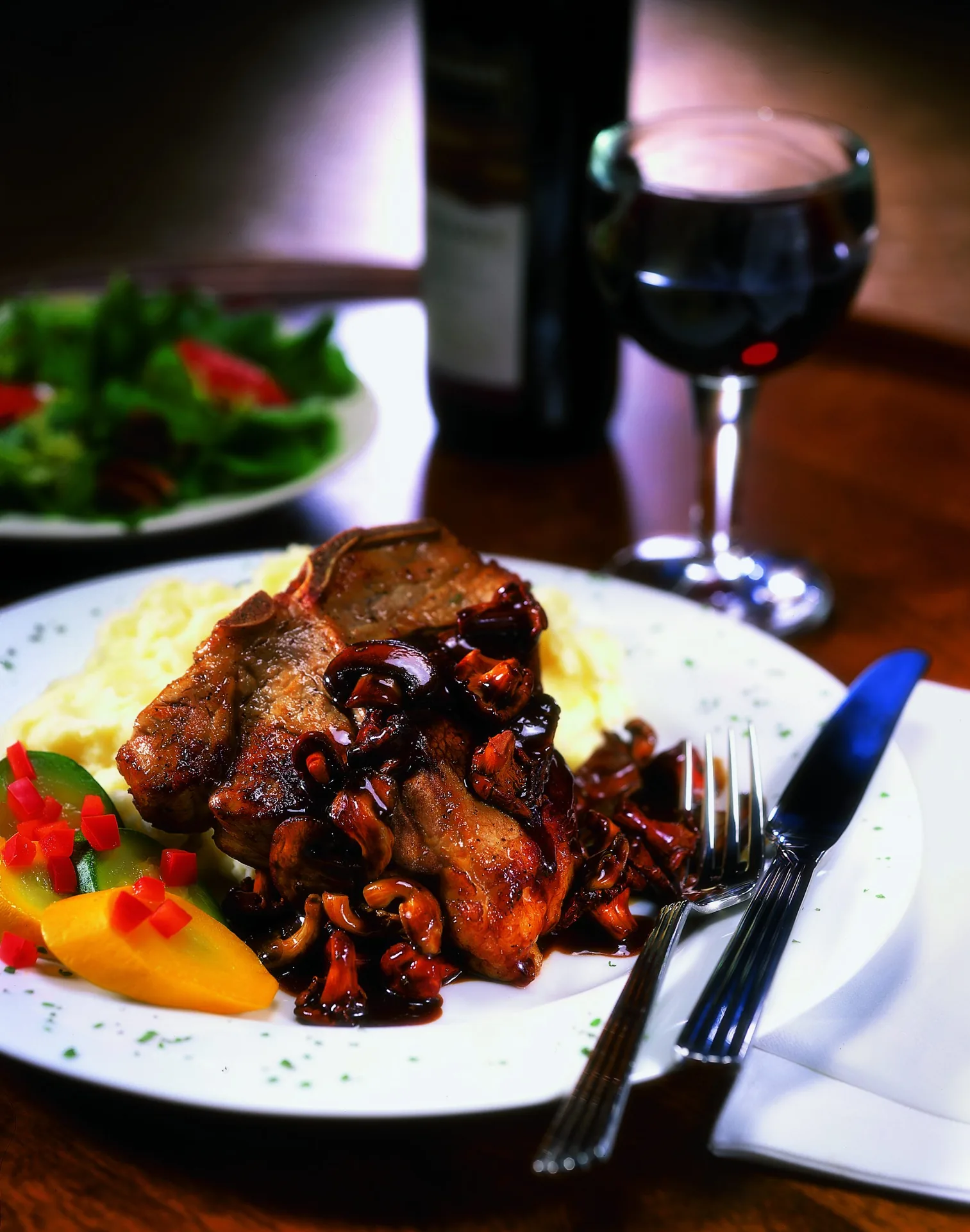 Cajun Veal Chop Smothered in Wild Mushroom Barbeque Demi-Glaze background image