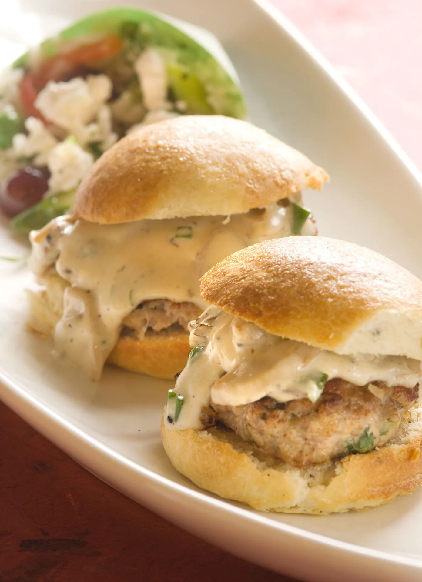Veal Burgers on Truffle-Potato Buns and Rice Salad with Goat Cheese and Tobasco Roasted Peppers background image