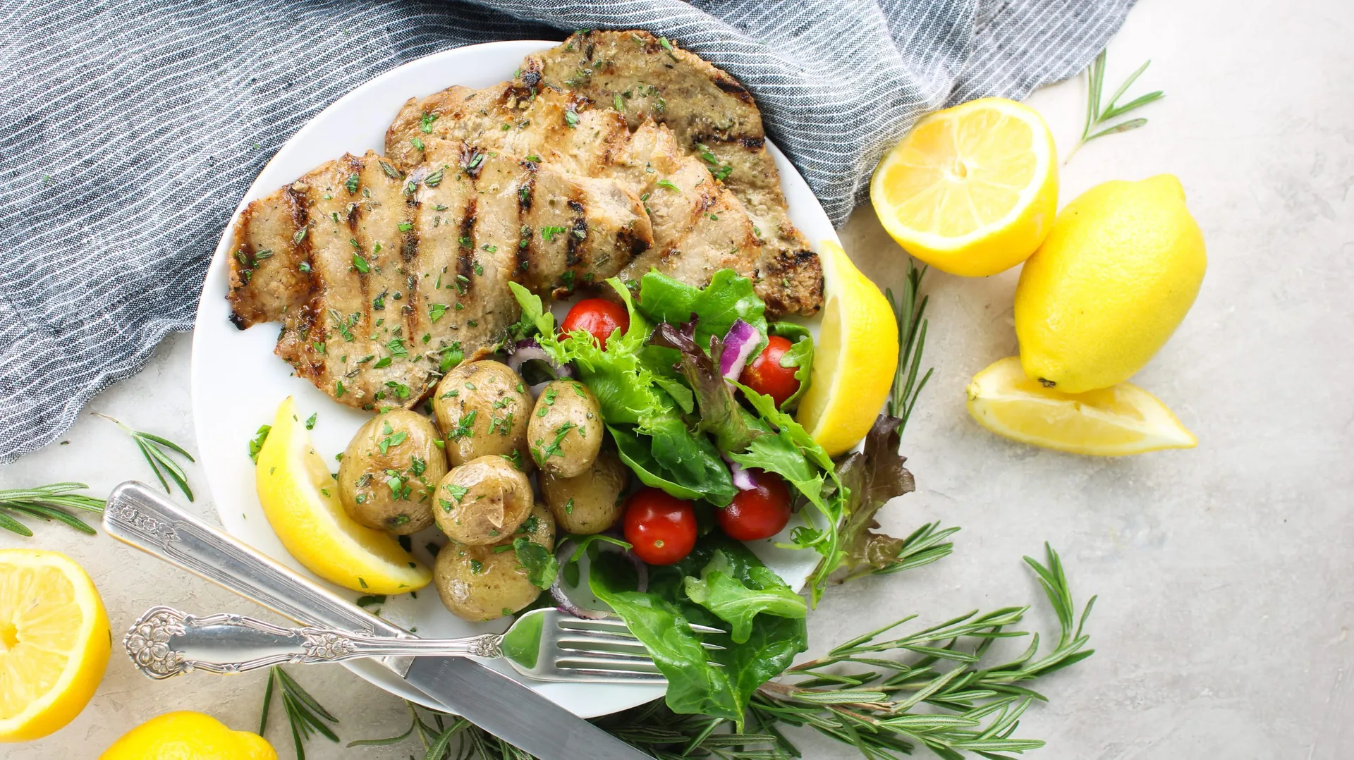 Grilled Rosemary and Lemon Veal Cutlets background image