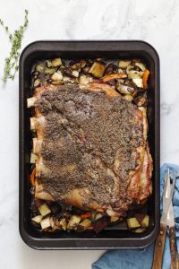 Roasted Veal Breast with a garlic and black pepper crust. Serve with roasted carrots, potatoes, onions, and mushrooms underneath.