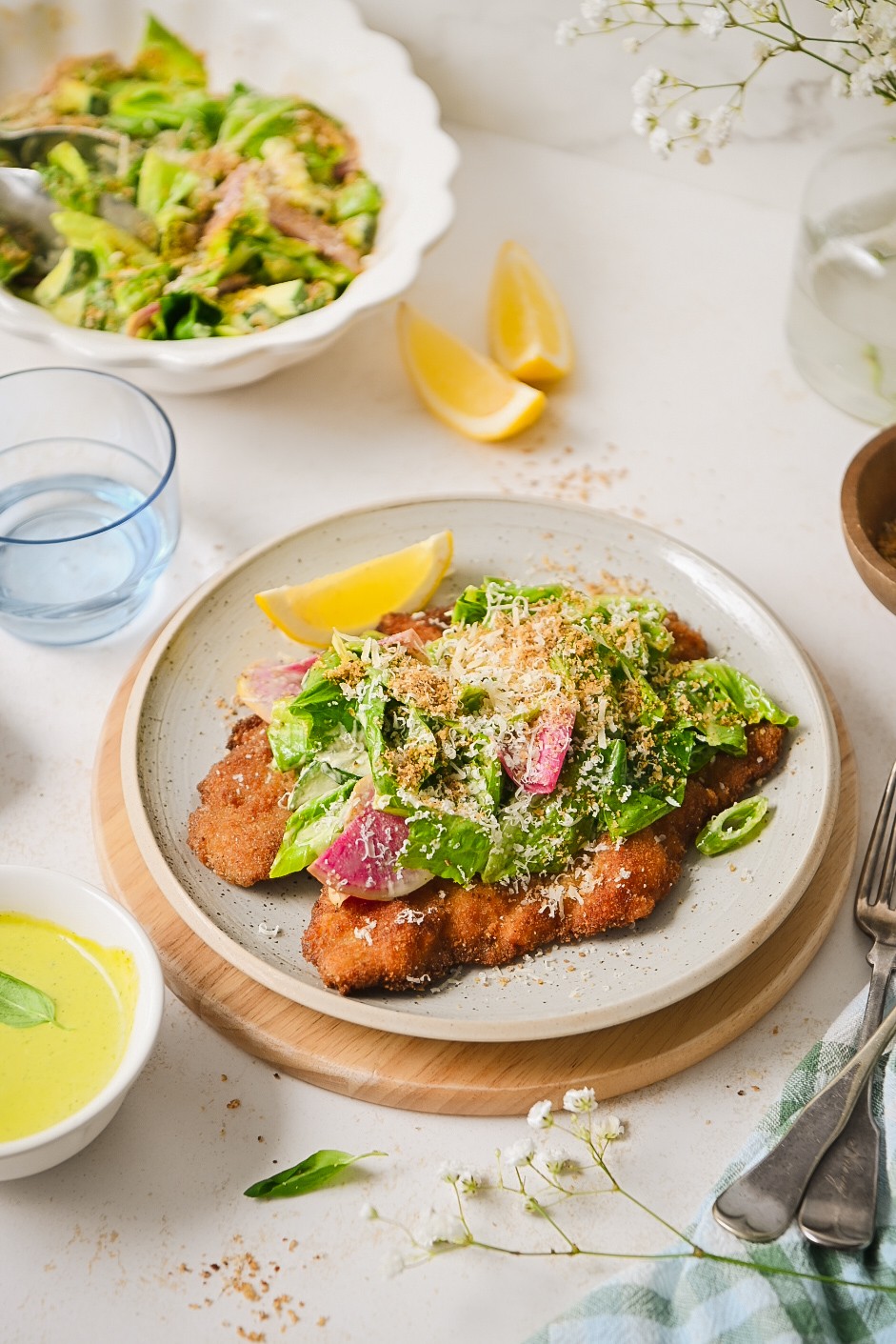 Light Veal Scallopini with a Bright Spring Caesar background image