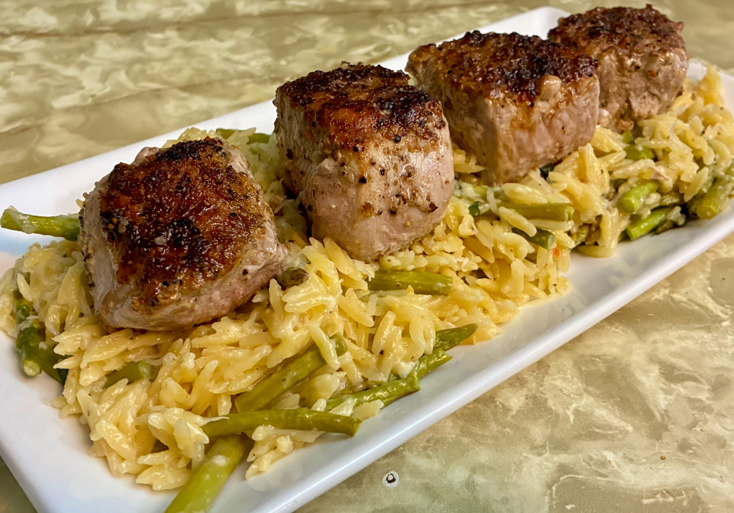 Lemon Pepper Veal Medallions with Baked Orzo background image